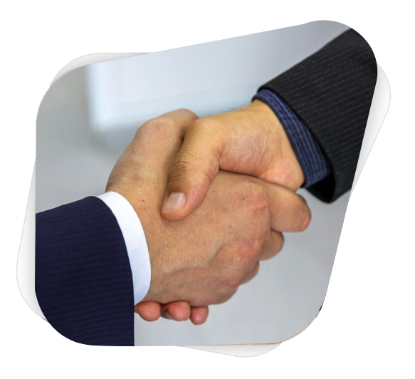 Close-up of two businessmen shaking hands, symbolizing agreement and partnership.