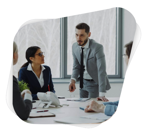 Professionals engaged in a serious business discussion in a bright office environment.