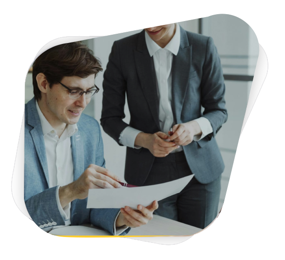 Two business people reviewing documents together